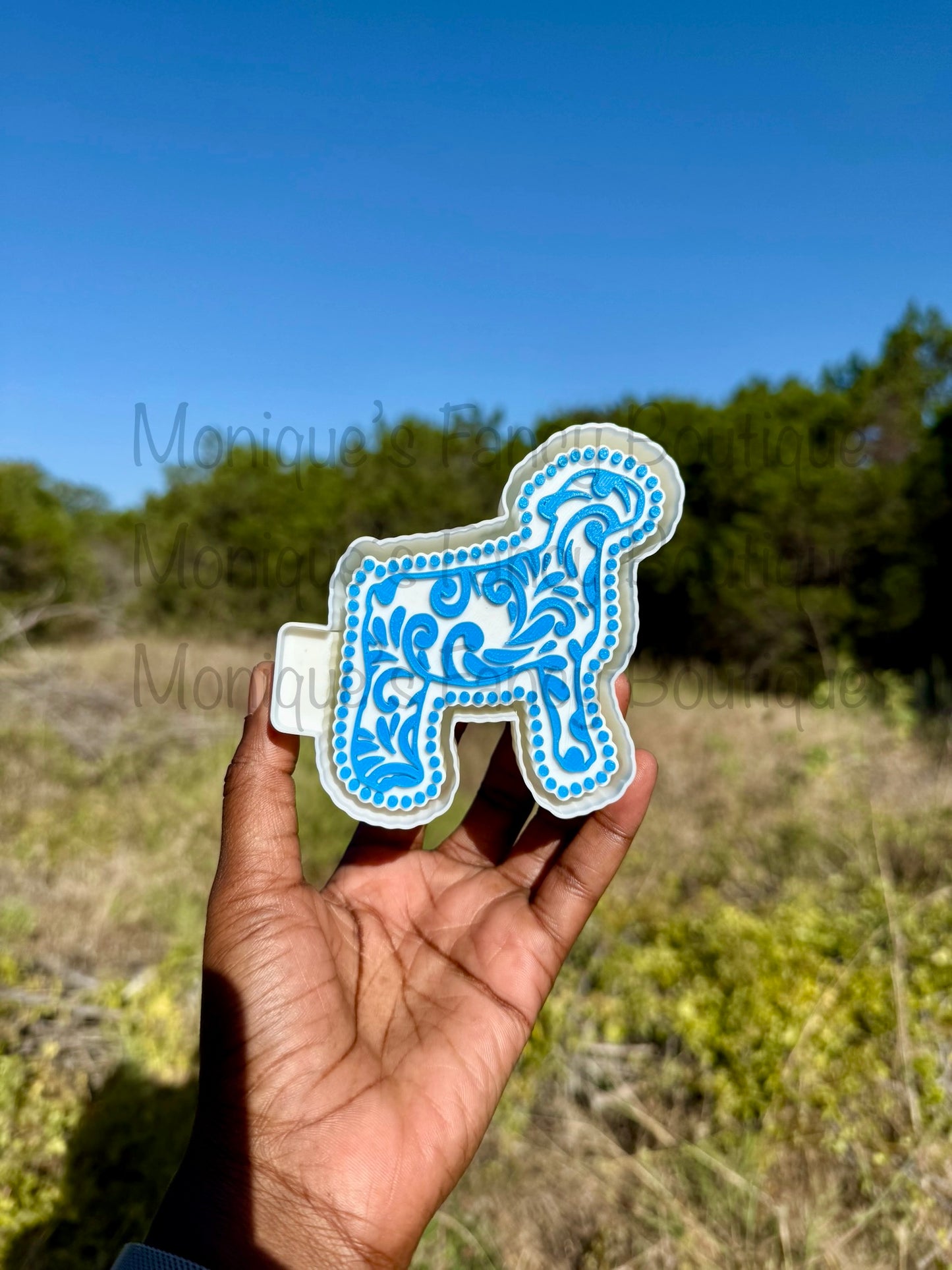 Lamb Freshie featuring a scroll design